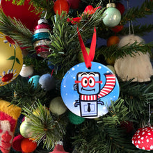 Christmas tree with colorful decorations, including an M. Bubz ornament